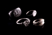 Late Roman and early Byzantine. Lot of Four bronze finger rings, showing different engravings (a Greek inscriptions, a Christogramm, a standing figure...