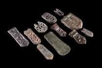 Lot of 11 Roman and Byzantine Bronze Belt-fittings and decorative elements (1.9-4.7cm). Various forms and decorations.