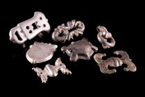 Lot of 7 Medieval Gilt Bronze and Silver Fittings, comprising a silver belt buckle. c. 10th-12th century. Minor corrosions, mostly intact.