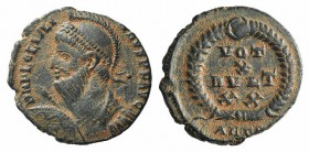Julian II (360-363). Æ (17mm, 2.51g, 6h). Antioch, 362-3. Helmeted, diademed and cuirassed bust l., holding spear and shield. R/ VOT/ X/ MVLT/ X X in ...