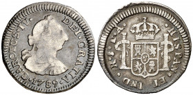 1789. Carlos IV. Santiago. DA. 1/2 real. (AC. 327). Leves rayitas. Busto de Carlos III. Ordinal IV. Rara. 1,62 g. BC/BC+.