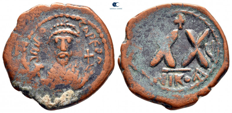 Phocas AD 602-610. Nikomedia
Half Follis or 20 Nummi Æ

23 mm, 5,39 g



...