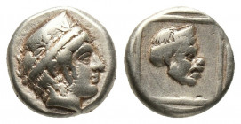Greek
Lesbos. Mytilene 412-378 BC.Hekte EL Head of Artemis-Kybele right, wearing stephane / Comic mask right within linear square within incuse square...