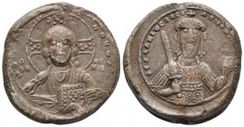 BYZANTINE LEAD SEAL  ISAAC I COMNENUS EMPIRE (1057-1059)
Obverse: bust of Jesus. He has a curly beard in front, long wavy hair, his halo is Crusader,...