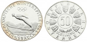 Austria 50 Schilling 1964 Averse: Value within beaded circle; small spray of leaves below; 3/4 circle of shields surrounding. Reverse: Innsbruck - Ski...