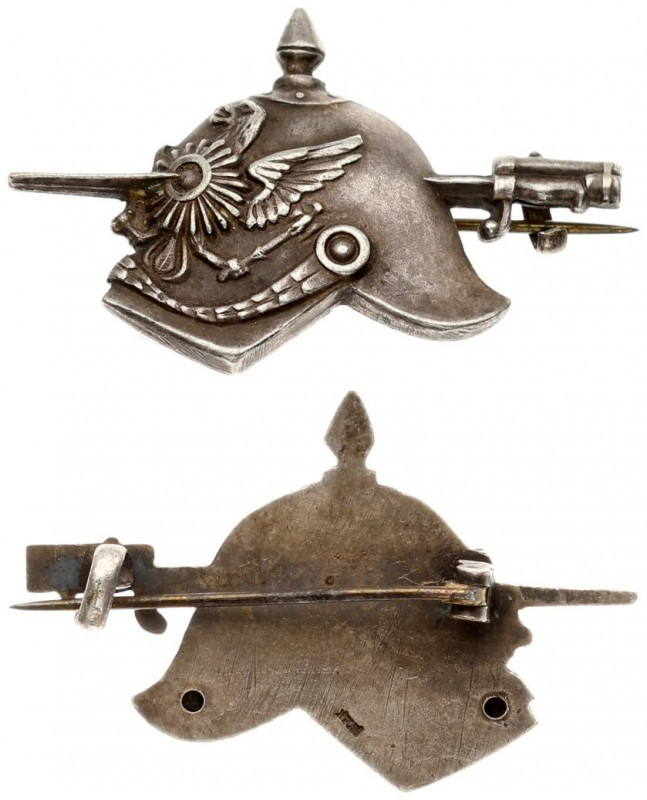 Germany Badge (1918). Helmet pierced with a bayonet. On the other side there is ...