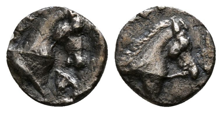 Calabria. Tarentum 380-228 BC.
Obol AR

6mm., 0,33g.

Horse's head right / ...