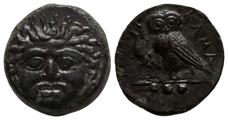 Sicily. Kamarina 420-405 BC.
Tetras Æ

15mm., 3,52g.

Gorgoneion facing, to...