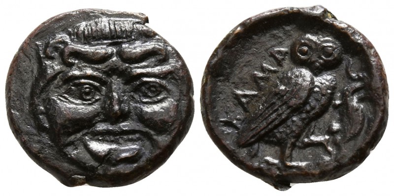 Sicily. Kamarina circa 420-405 BC.
Onkia Æ

10mm., 1,44g.

Facing gorgoneio...