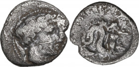 Greek Italy. Central and Southern Campania, Allifae. AR Obol, 325-275 BC. Obv. Head of Apollo right, laureate, surrounded by three dolphins. Rev. Scyl...