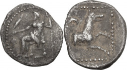Greek Asia. Lycaonia, Laranda. AR Obol, c. 324/3 BC. Obv. Baaltars seated left, holding grain ear and grape bunch in extended right hand, scepter in l...