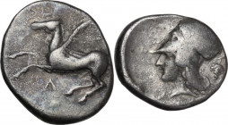 Continental Greece. Akarnania, Leukas. AR Stater, c. 390-380 BC. D/ Pegasos flying left; below, Λ. R/ Helmeted head of Athena left; behind, bunch of g...