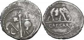 Julius Caesar. AR Denarius, uncertain mint, 49-48 BC. Obv. Pontifical emblems. Rev. Elephant right, trampling dragon. Cr. 443/1. AR. 3.83 g. 20.00 mm....
