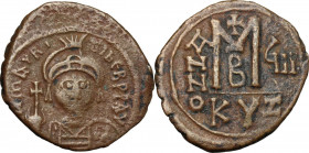 Maurice Tiberius (582-602). AE Follis, Cyzicus mint. Obv. Helmeted and cuirassed bust facing, holding globus cruciger and shield. Rev. Large M between...