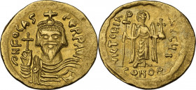 Phocas (602-610). AV Solidus, 607-609, Constantinople mint. Obv. Bust facing, crowned, draped, cuirassed, holding cross. Rev. Victory standing facing,...