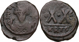 Phocas (602-610). AE Half Follis. Carthage mint. Dated RY E. Obv. Crowned bust facing, holding mappa and long cross. Rev. Large X·X; star to left, cro...