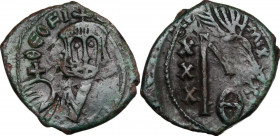 Theophilus (829-842). AE Follis, Constantinople mint. Obv. Bust facing, crowned, holding globus cruciger. Rev. Large M (mark of value) and rests of th...