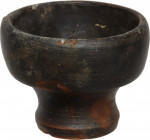 Black-glazed miniature cup. 4.5 cm high. Campania, 4th century BC. NO EXTRA-EU EXPORT.