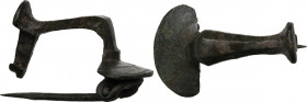 Bronze fibula with round ornamented plate. 36x22 mm. Roman period 1st-2nd century. Intact.