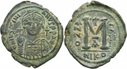 Justinian I, 527-565. Follis (Bronze, 38 mm, 17.87 g, 6 h), Nicomedia, RY 24 = 550/1. D N IVSTINIANVS P P AVI Helmeted and cuirassed bust of Justinian...