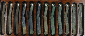 China - Showcase containg 12 pieces Eastern Zhou, Warring States period, Yan, Ming knife money (400-220 BC) - very attractive set with find encrustati...