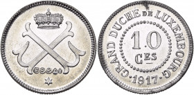 LUXEMBOURG, Marie-Adélaïde (1912-1919), 10 centimes, 1917. Essai en aluminium. Tranche cannelée. 50 exemplaires frappés. P. L353-6. 1,29g Taches.
Fle...