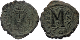 JUSTINIAN I (527-565) AE Follis, Constantinople, Dated Year 31 (557/8 AD). 
D N IVSTINIANVS P P AVG - Helmeted, diademed, and cuirassed bust facing, h...
