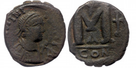 Justinian I (527-565) AE29 Follis, Constantinople mint, 1st officina. 
Diademed, draped, and cuirassed bust right; staurogram to right 
Rev: Large M; ...
