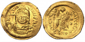 JUSTINIAN I (527-565). GOLD Solidus. Constantinople
D N IVSTINIANVS P P AVG. Helmeted and cuirassed bust facing, holding globus cruciger and shield de...