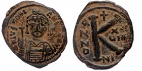 Justinian I AD 527-565. Nikomedia Half Follis or 20 Nummi AE
Helmeted and cuirassed bust facing, holding globus cruciger and shield decorated with hor...