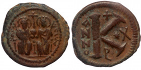 Justin II (565-578) AE24 half follis Constantinople 
IVSTI - NVS P P A (or simillar), - Justin on left and Sophia on right seated facing on double-thr...