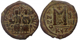 Justin II and Sophia (565-578) Dated RY 9 (573/4). Cyzicus. 1nd officina
AE29 Follis
D N IYSTI-NYS P P AV - Justin and Sophia seated facing on double ...