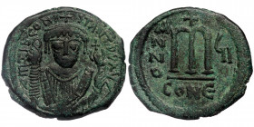 Tiberius II Constantine. 578-582.AE Follis Constantinople mint.
Crowned bust facing, wearing consular robes, holding mappa in right hand and eagle-tip...
