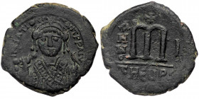 Maurice Tiberius. (582-602) AE Follis Antioch, year 1 = 582/583. 
INIATIO-NIT PP AIV (sic) - facing bust, wearing crown with trefoil ornament and cons...