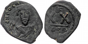 PHOCAS (602-610) AE Half Follis. Constantinople.
Obv: D N FOCAS PERP AVC.
Crowned bust facing, wearing consular robes and holding mappa and cross.
Rev...