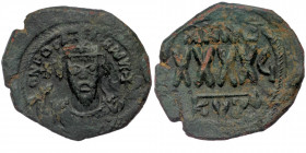 Phocas, 602-610. Follis Cyzicus, AE 
Crowned bust of Phocas facing, wearing consular robes, holding mappa in his right hand and cross in his left. 
Re...