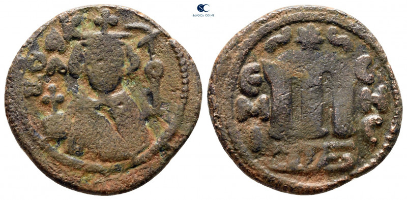 Time of 'Abd al-Malik ibn Marwan AH 65-86. Hims (Emesa) mint
Fals Æ

22 mm, 4...