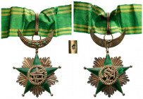 COMOROS ISLANDS
ORDER OF THE STAR OF COMOROS
Commander's Cross, 3rd Class, 2nd Type, instituted in 1910. Neck Badge, 80x60 mm, gilt Silver, French h...