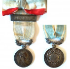 FRANCE
Colonial Medal, instituted in 1893
Breast Badge, 30 mm, Silver, original suspension ring and ribbon with "Algerie" clasp, sewn tricolor ribbo...