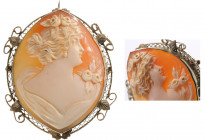 FRANCE
Large Shell Cameo
A large shell cameo brooch in openwork gold mount, oval form, an elegant lady profile, flowers in relief ans draped. Dimens...