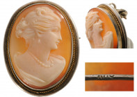 FRANCE
Oval Shell Stone Cameo
An oval shell stone cameo brooch, an elegant lady profile with a ring, pearl silver frame, probably France circa 1900....