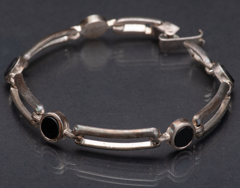 GERMANY
Silver mesh bracelet 
Mounted onyx cabochons, 1940s Art Deco work. Gua...