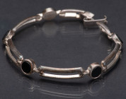 GERMANY
Silver mesh bracelet 
Mounted onyx cabochons, 1940s Art Deco work. Guarantee 800, silversmith stylized monogram "G.F", probably Germany, len...