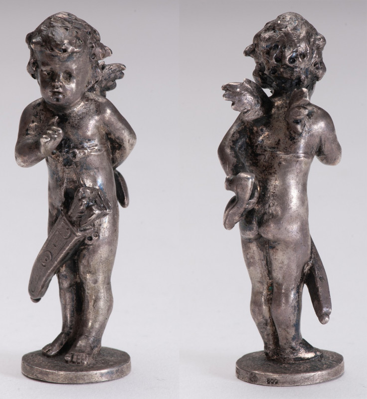 GERMANY
Silver bottle stopper about Cupid concealing a woman's shoe on her back...