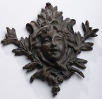 INTERNATIONAL
Part of bronze door knocker
Antique element in relief, wide floral decoration surrounding a child's face. Very good quality period ear...