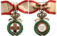 MONTENEGRO
Order of the Red Cross
A Badge of the 3rd Model, 55x32 mm,in gilt Silver and enamels,with separately made medallions, the obverse with Mo...