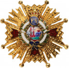 SPAIN
ORDER OF ISABELLA THE CATHOLIC
A lapel miniature of the Grand Cross in gold, 21 mm, with chiselled rays with red enameled arms; polychrome ena...