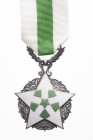 SYRIA
ORDER OF THE CIVIL MERIT
Knight's Cross. Breast Badge, 52x44 mm, silvered Bronze, one-side enameled, original suspension device and ribbon. I ...