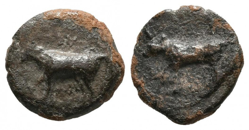 EBUSUS (Ibiza). 1/8 Calco. (Ae. 1,10g/11mm). 300-200 a.C. (FAB-906). Anv: Toro a...