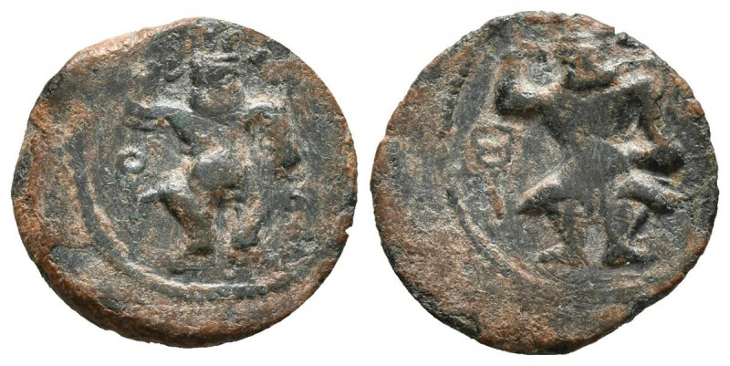 EBUSUS (Ibiza). 1/4 Calco. (Ae. 1,15g/15mm). 200-100 a.C. (FAB-936). Anv: Bes co...